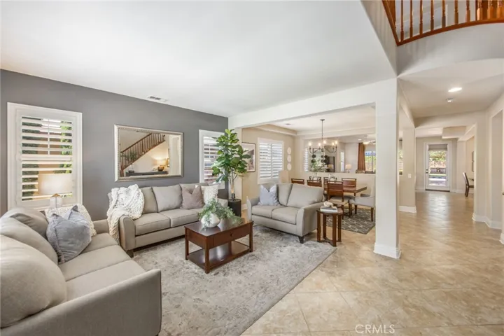 Spacious living room with an open layout and seamless flow to adjacent living areas