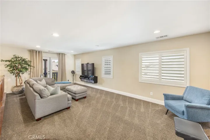 Versatile upstairs loft ideal for a media room or additional living area
