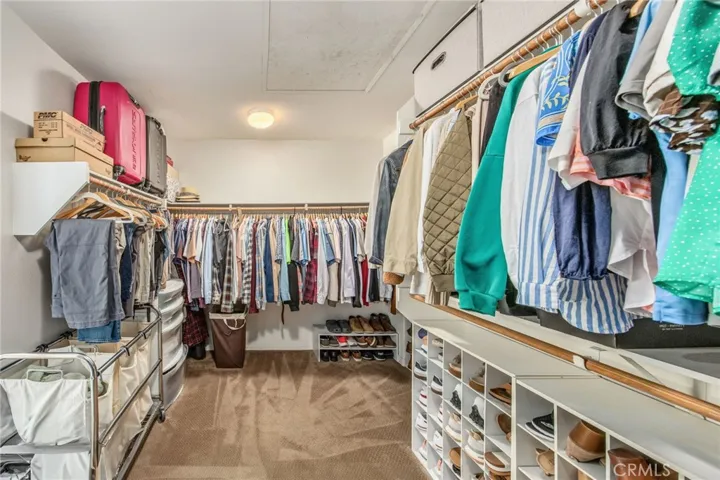 Spacious walk-in closet offering generous storage and organization options