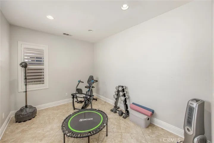 Versatile flex room ideal for a home office, gym, playroom, or additional living space