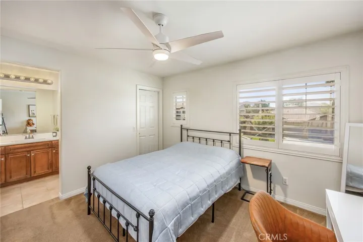 Secondary bedroom with an attached bathroom and comfortable layout