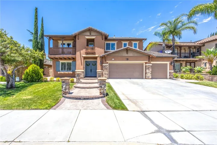 Welcoming front porch leads to the double-door entry