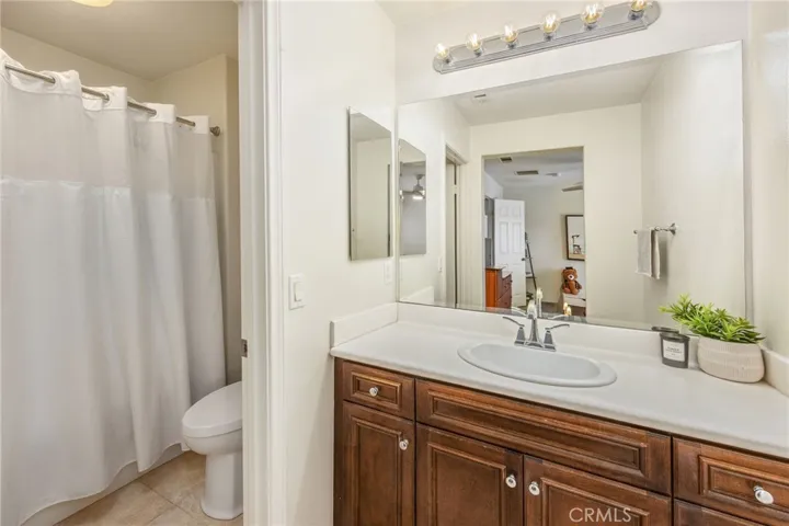 Full bathroom with a single-sink vanity and shower/tub combination