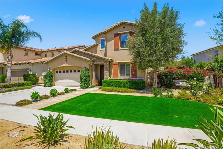 Front yard and side entrance to backyard.