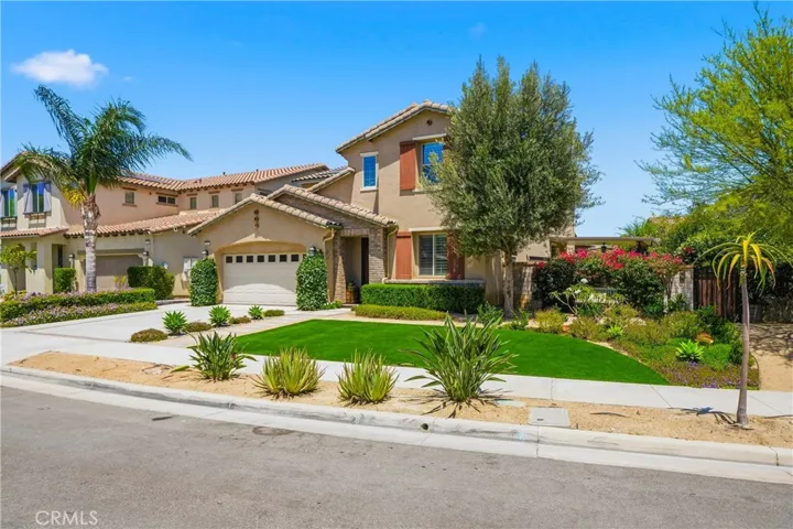 Front yard view with turf lawn.