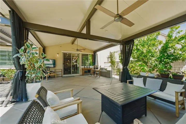 Backyard patio with retractable mosquito nets. .