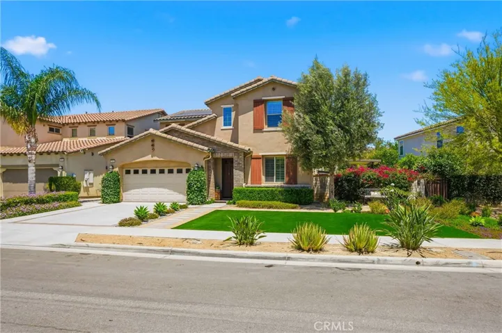 Front view with walkway to backyard entrance.