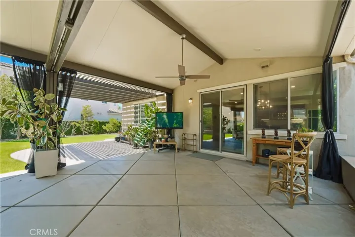 Backyard patio with retractable mosquito nets.