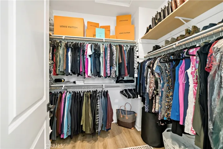 Owners Walk in closet with additional shelving