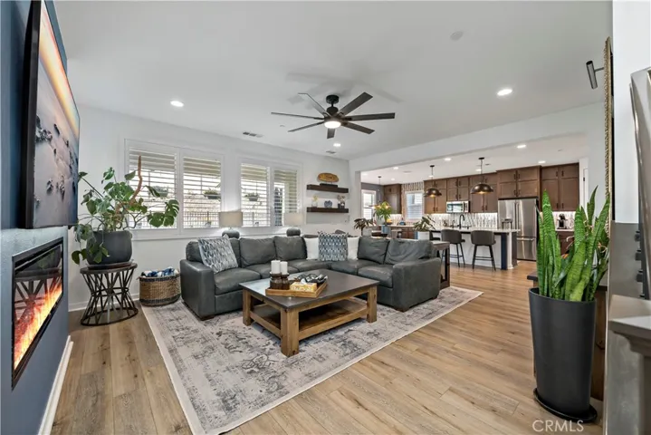 Great Room with recessed lighting, fireplace and ceiling fan