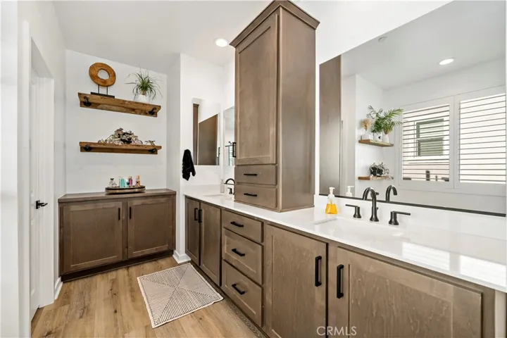 Owners en suite with additional custom cabinetry