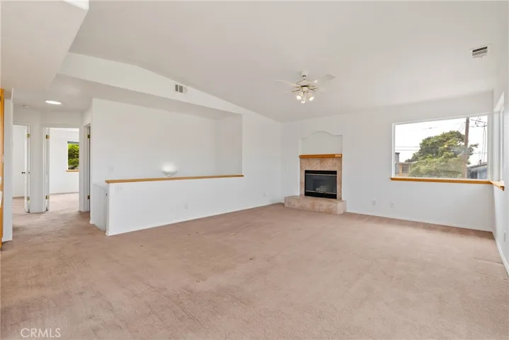 Electric Fireplace in the large living room gives a warm ambiance in the winter months, raised ceilings give the living room a open and spacious feel