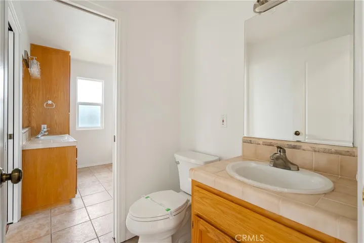 Primary bath also has powder room access to living room