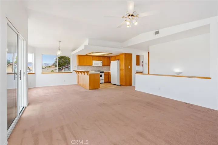 Open floor plan design gives lots of natural light and expansive views from the living room, dining room  and kitchen