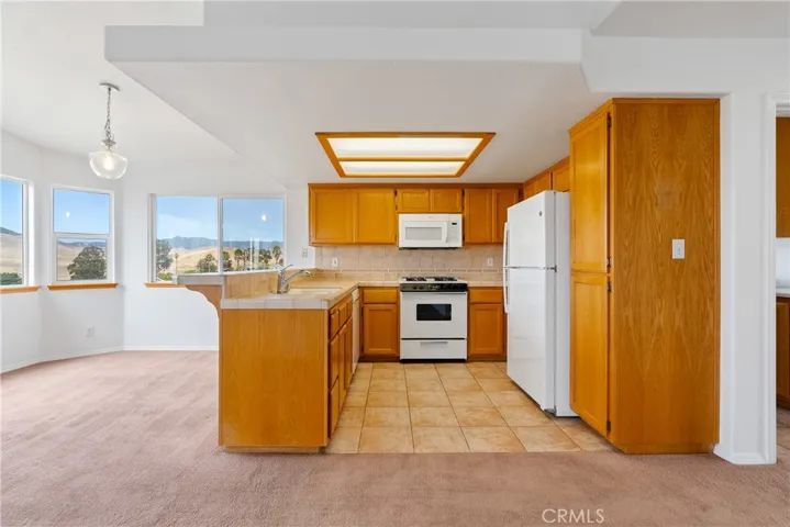 Breakfast bar adjacent to the kitchen, just add bar stools.