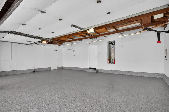 3 Car garage with brand new epoxy flooring.