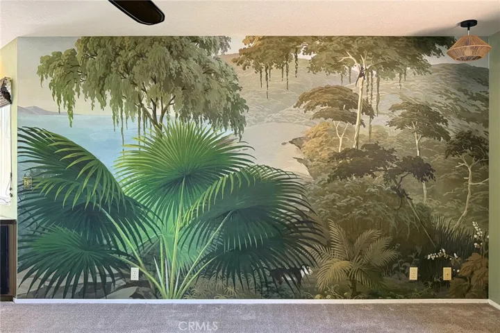 This wallpaper mural came from France. Find the monkey in the mural.