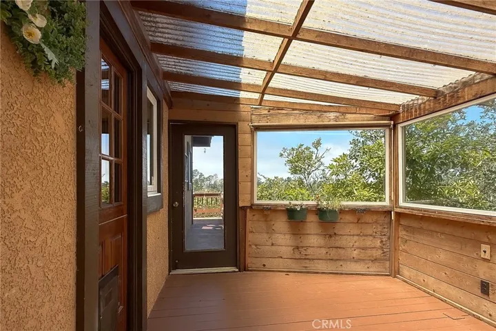 Enclosed sun deck off the kitchen for year-round enjoyment