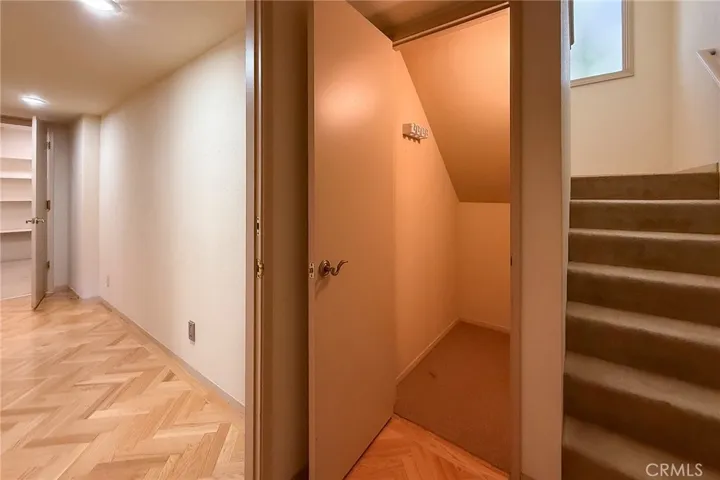 Downstairs with plenty of storage - under stairs and walk-in with shelves at the end of the hall.
