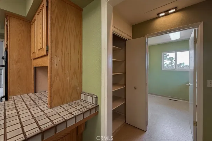 Pantry off the kitchen with convenient access to the laundry room