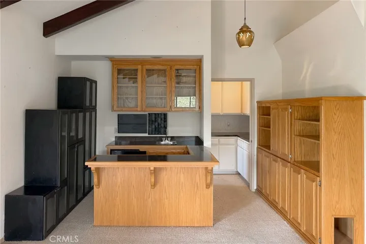 The functional wet bar adds convenience for entertaining family and friends. Hall to powder room on the right.