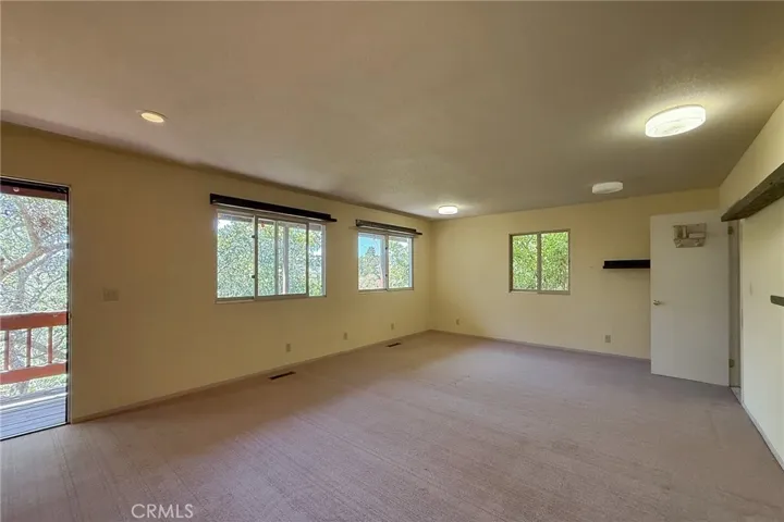 Large Guest bedroom number 2 with door out to back deck