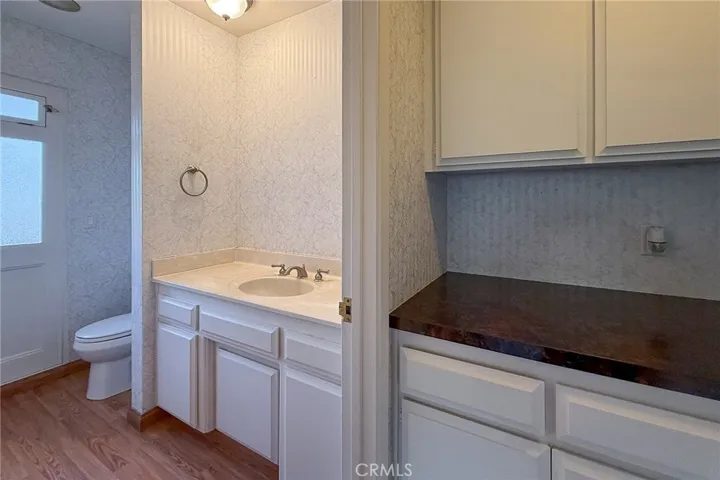 Powder room behind the wet bar