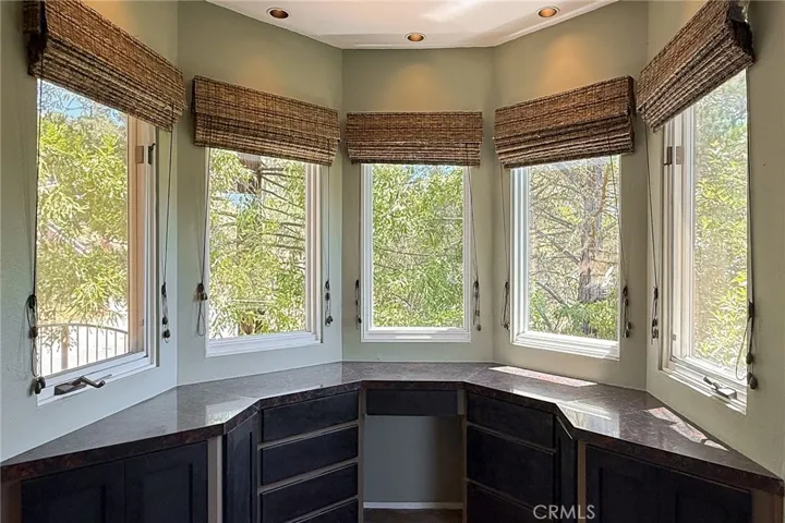 Wooded views from the built-in vanity in primary bedroom