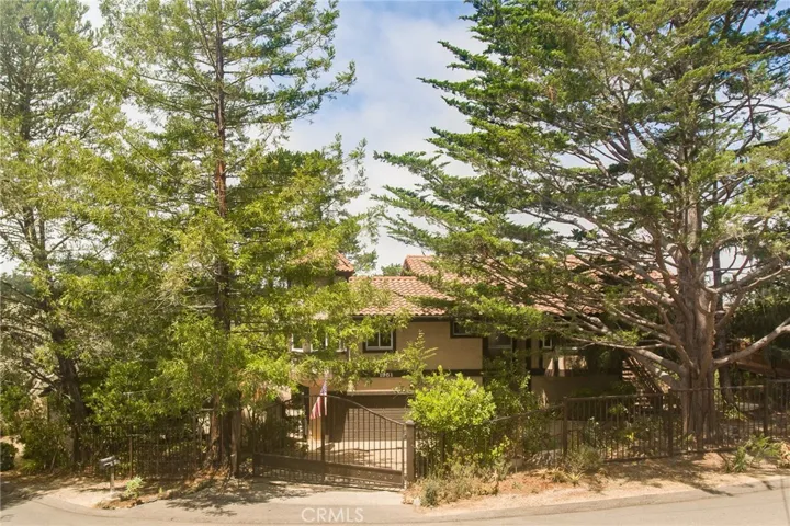 Gated entry adds to the property's sense of privacy and retreat with a two-car attached garage with a golf cart garage.