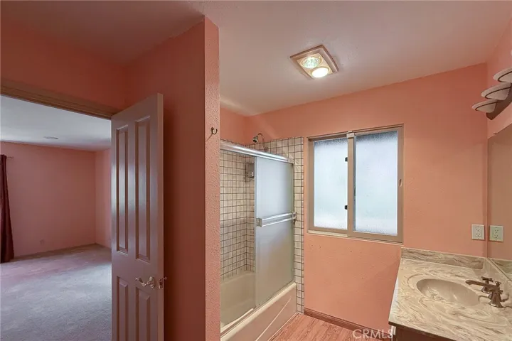 Jack and Jill full bathroom separates the two large downstairs bedrooms