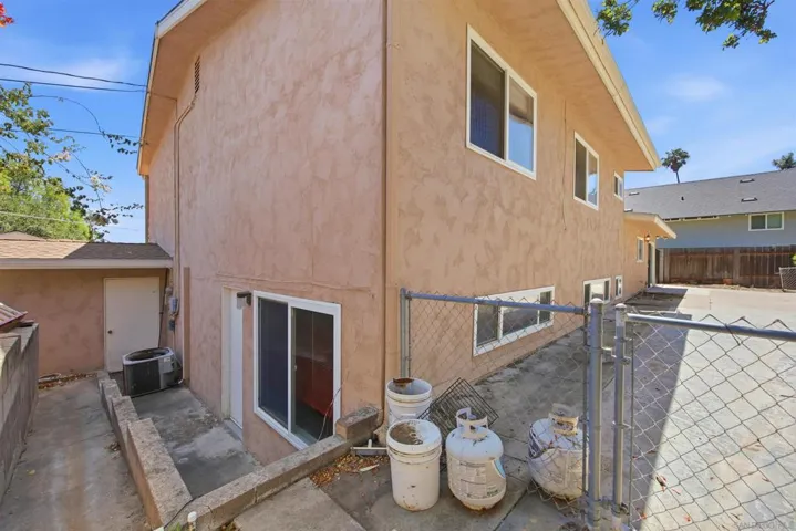 Side yard; private access to ground-level bedroom. Use as Airbnb, room rental, or maids' quarters.