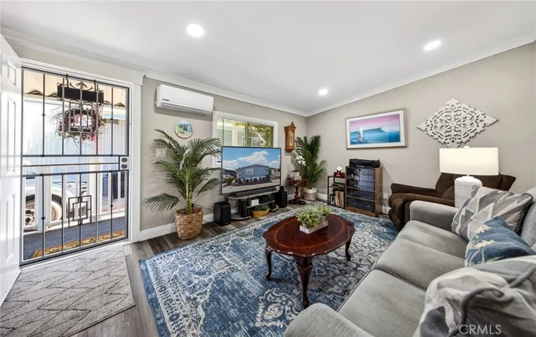 Livingroom, fresh paint, new flooring, new lights, new windows, split unit.