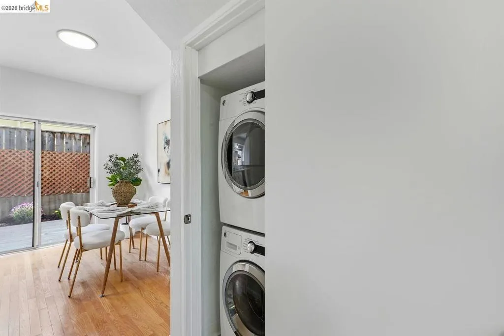 Stacked laundry appliances within a dedicated closet