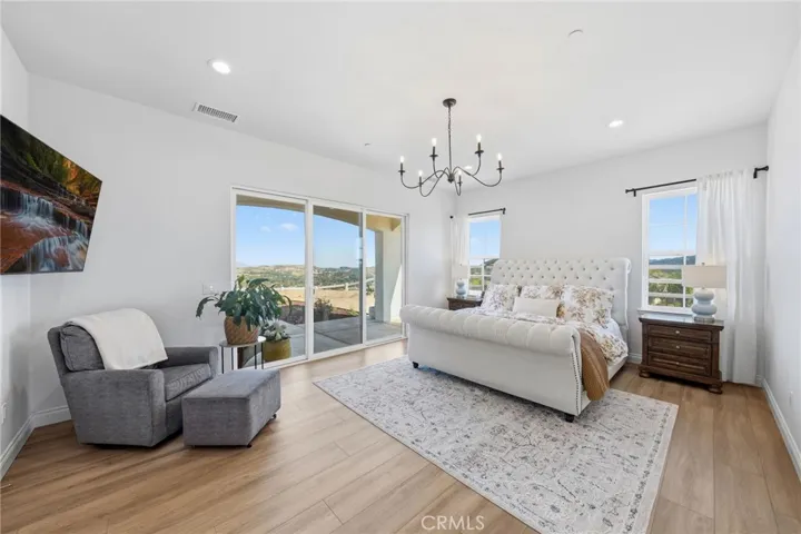 primary suite w/direct backyard access, private patio and VIEWS
