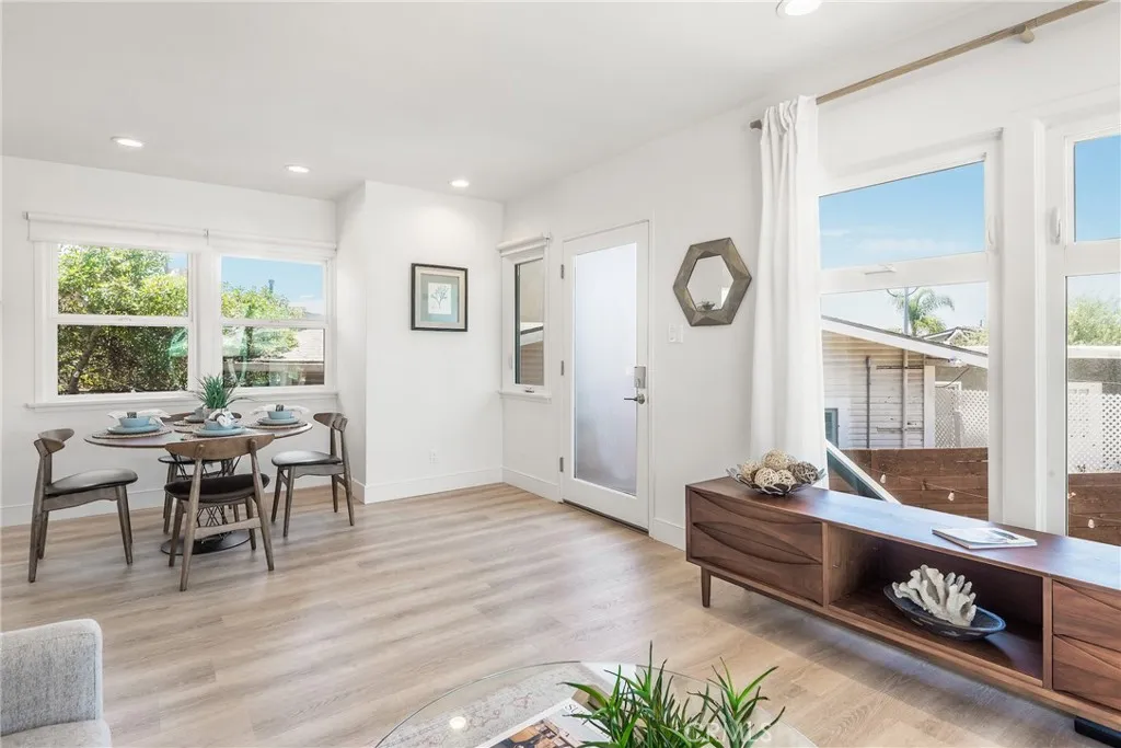 Upper unit showcasing the open floorplan, beautiful updates and large windows and sliders