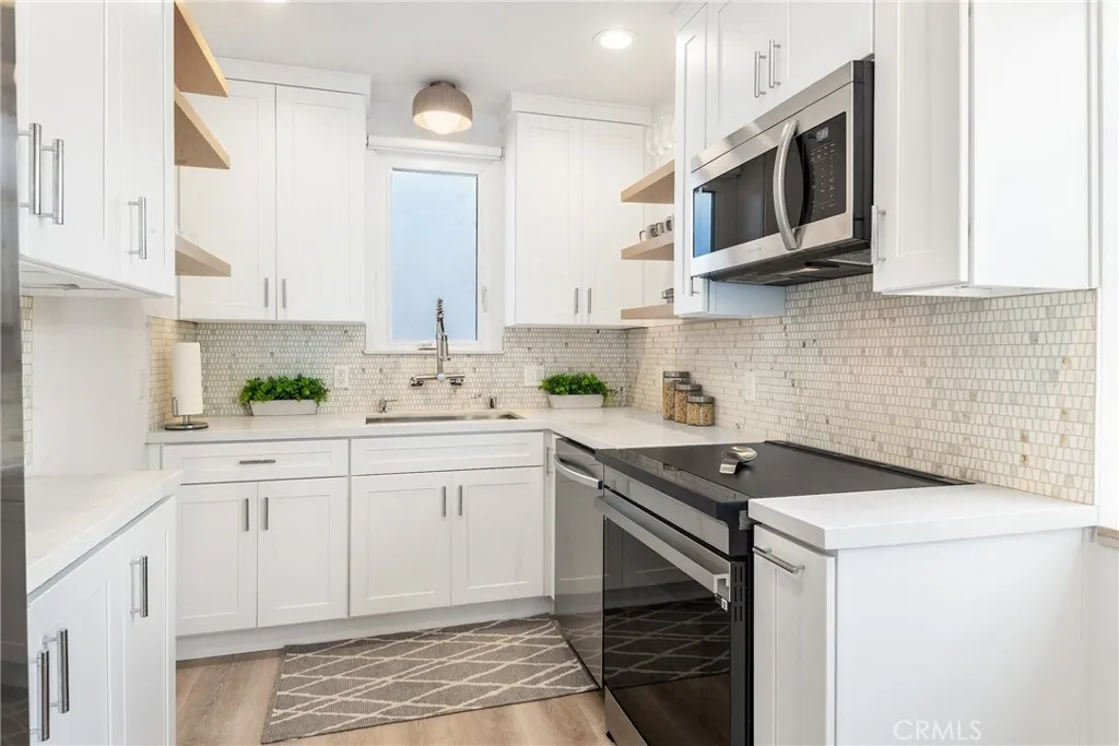 Upper unit - Sun kissed kitchen with wonderful light and luxury finishes in the upper home kitchen