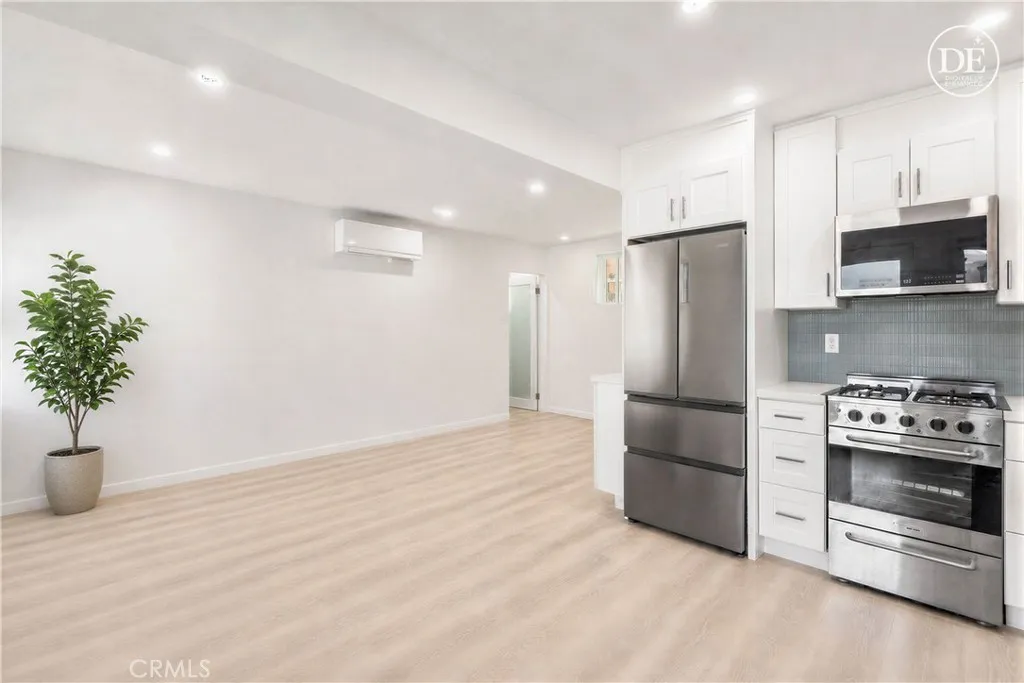 Lower unit - Open concept layout in the beautifully remodeled downstairs unit - digitally enhanced to remove tenant furniture and belongings