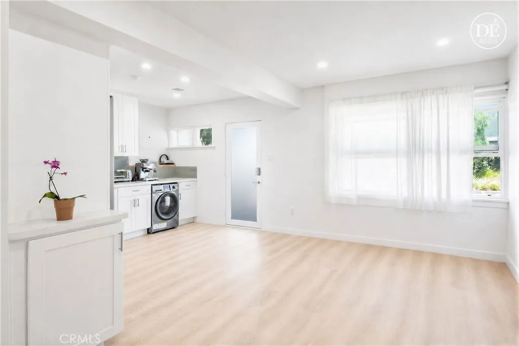 Lower unit - Open concept layout in the beautifully remodeled downstairs unit - digitally enhanced to remove tenant furniture and belongings