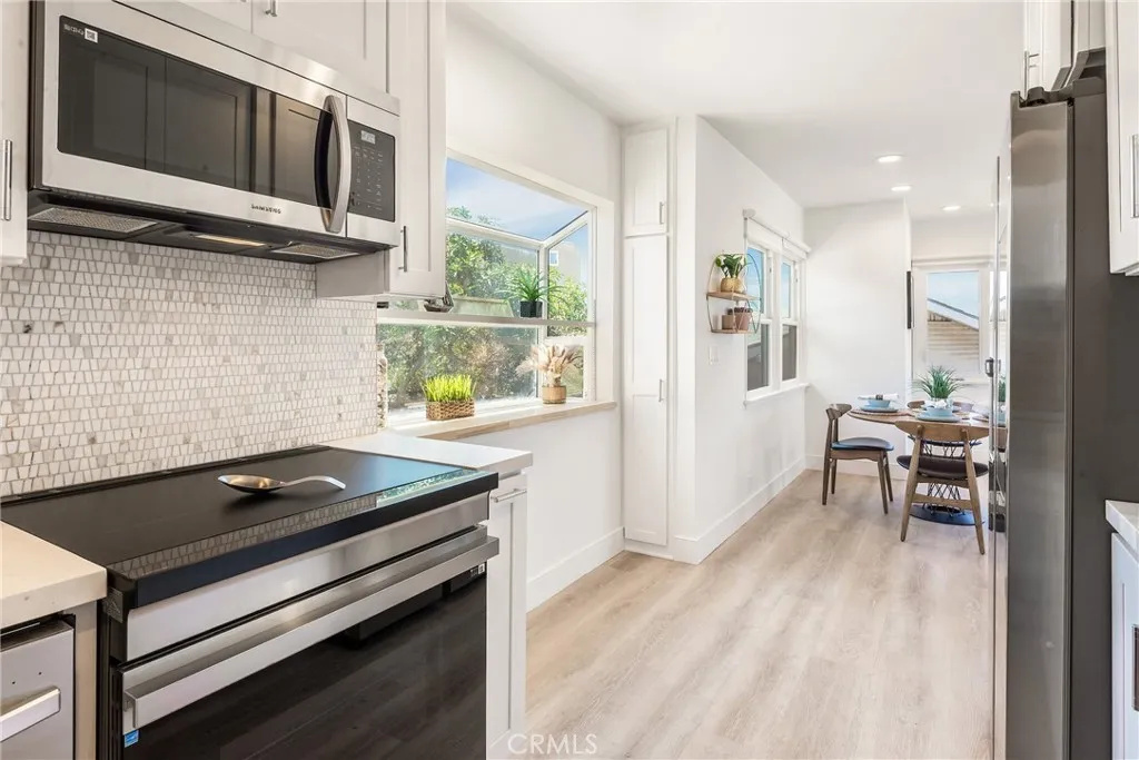 Upper unit - Sun kissed kitchen with wonderful light and luxury finishes in the upper home kitchen