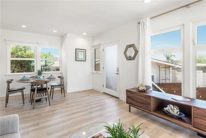 Upper unit showcasing the open floorplan, beautiful updates and large windows and sliders