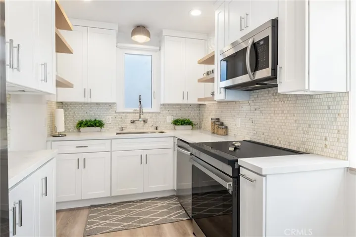 Upper unit - Sun kissed kitchen with wonderful light and luxury finishes in the upper home kitchen