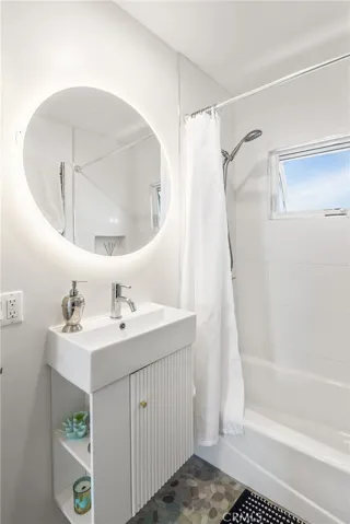Upper unit - Luxury upper unit bathroom with backlit and fog free mirror, floating vanity and toilet, towel warming bar and more