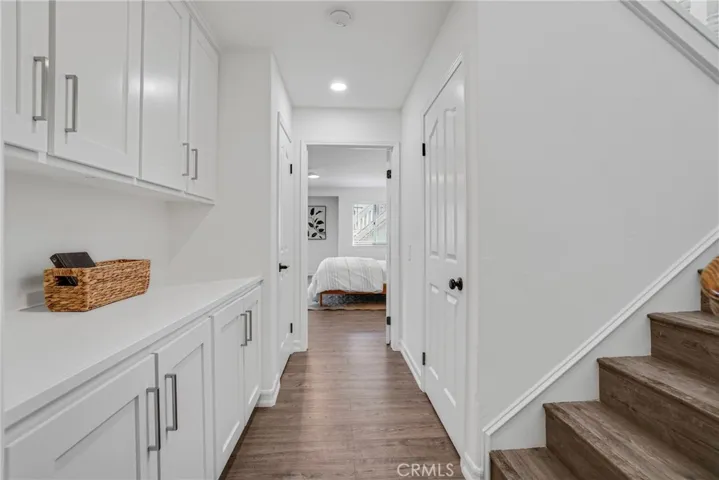 downstairs hall with pletiful linen and storage cabinets