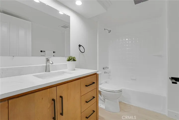 Hall Bathroom with new vanity, plumbing fixture, toilet , and more.