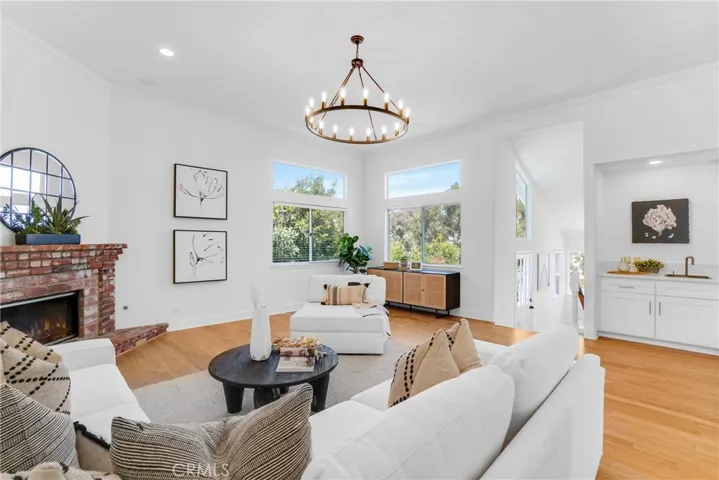 Family Room with Views! Gas Fireplace, updated wet bar, updated lighting, refinished hardwood  flooring, convenient adjacent updated 1/2 bath , updated lighting