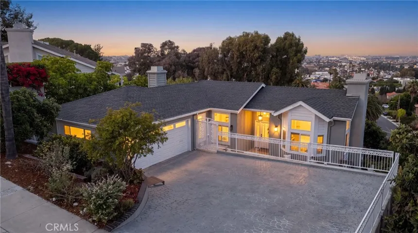 Hillside home with city and mountain views.  Photo is "twilight" enhanced.