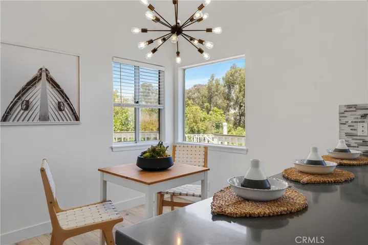 Breakfast Bar and breakfast nook with new light fixture and view !