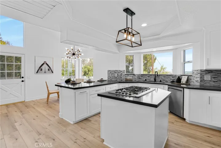 Kitchen with Island, Quartz counters, enjoy doing dishes with a city view, updated lighting and flooring, Breakfast Bar, Breakfast nook.