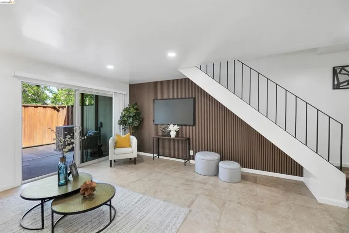 Bright living area featuring sliding glass doors to a private patio