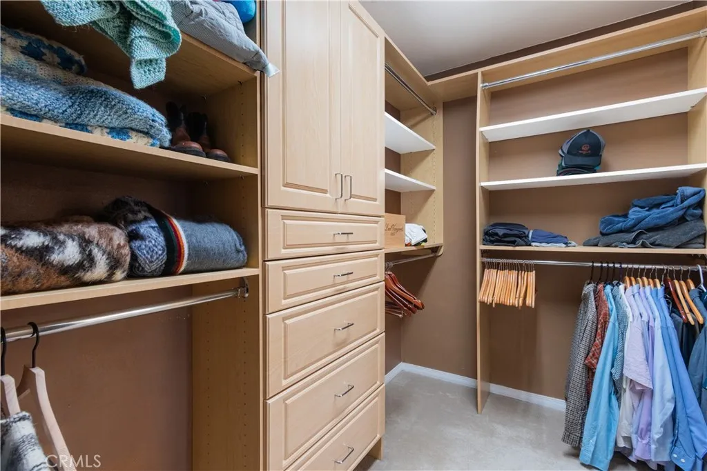 Walk-in closet in the primary bathroom.